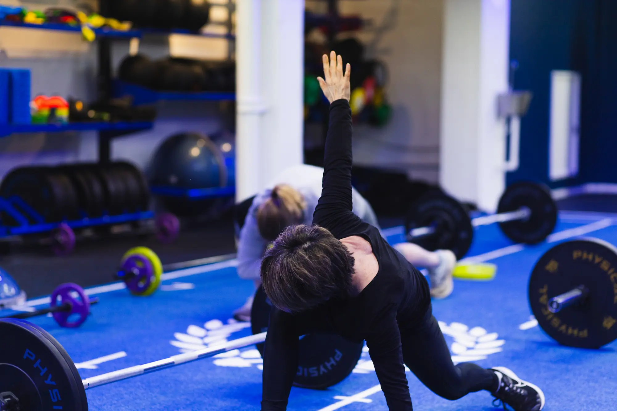 Woman stretching in gym